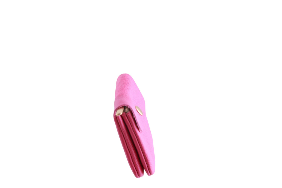 Portamonete in pelle con cerniera interna e bottone in tinta unita Made in Italy